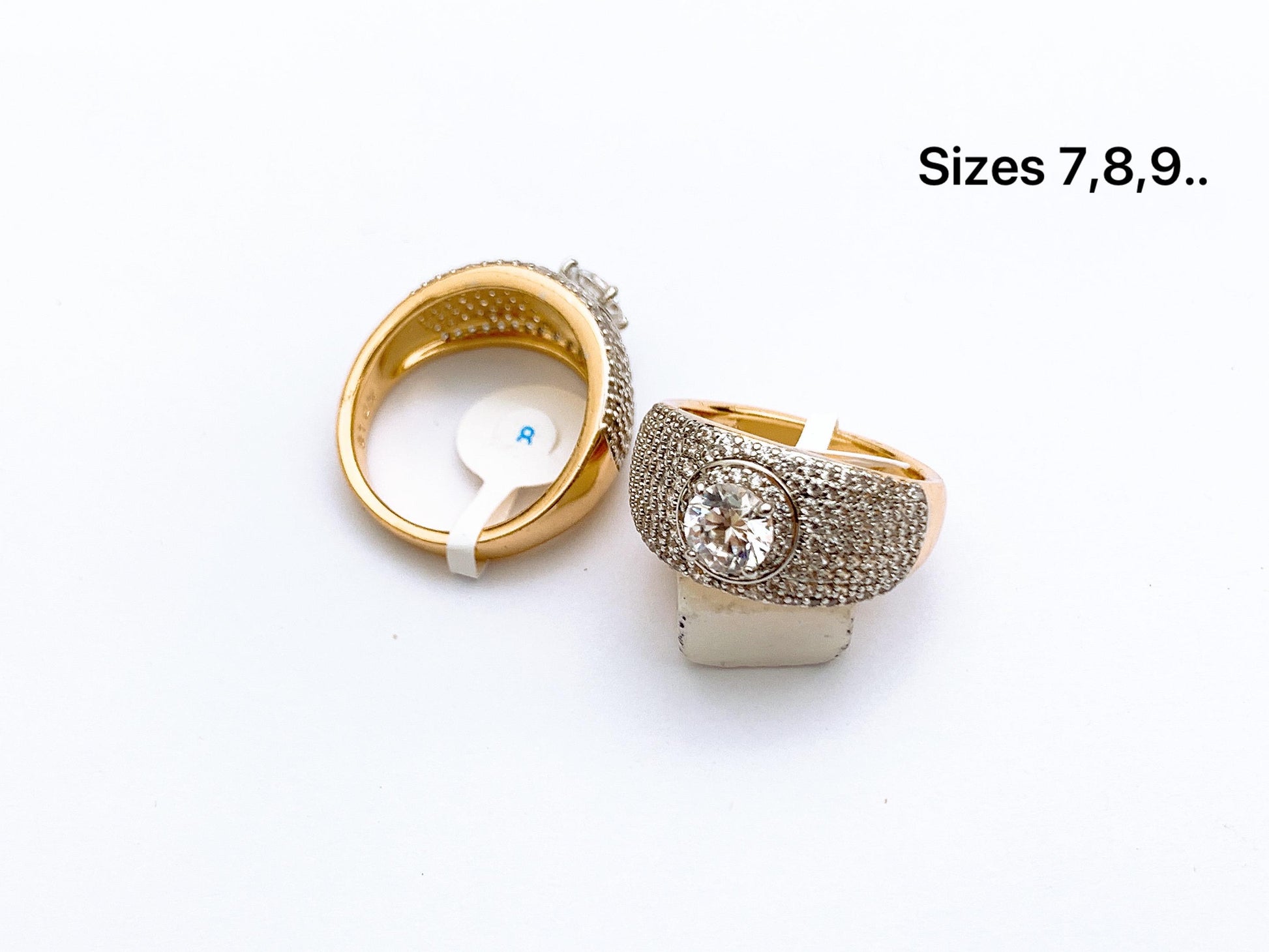 Fine stone round solitaire ring with studded band