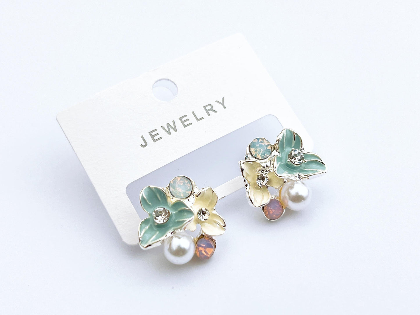 Pastel floral pearl stud earrings in mint green and cream
