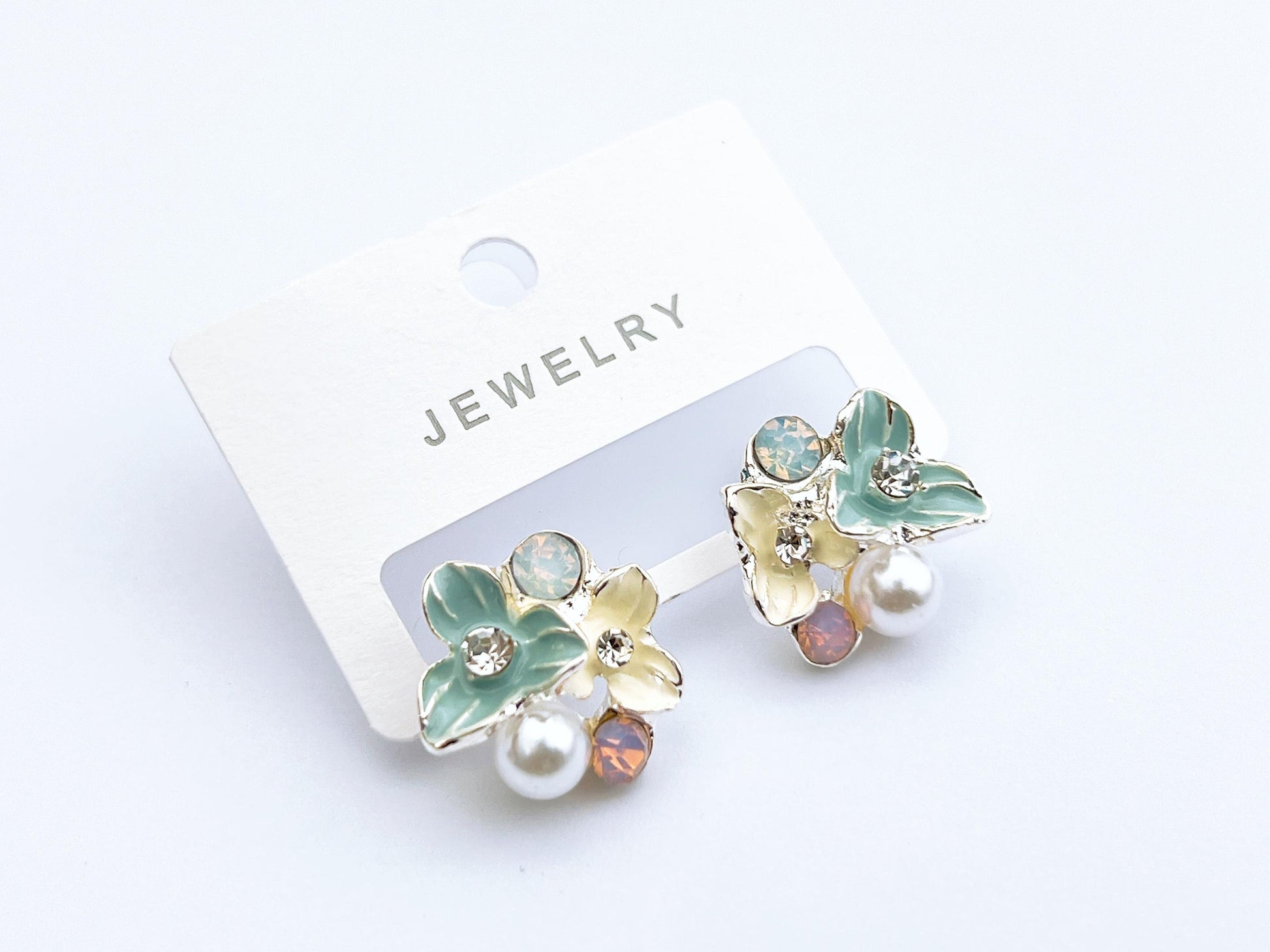 Pastel floral pearl stud earrings in mint green and cream