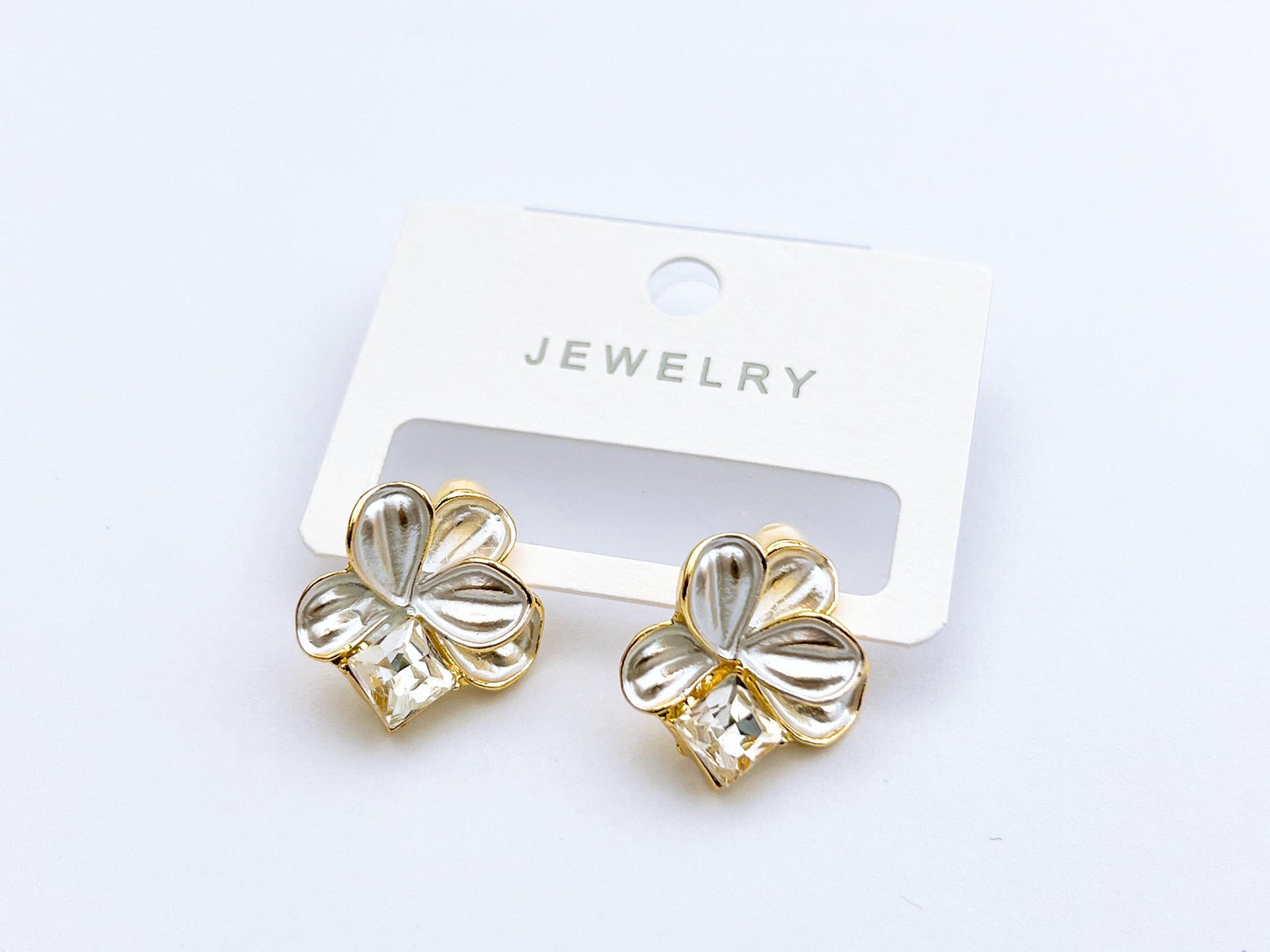 Golden crystal bloom stud earrings with floral shape