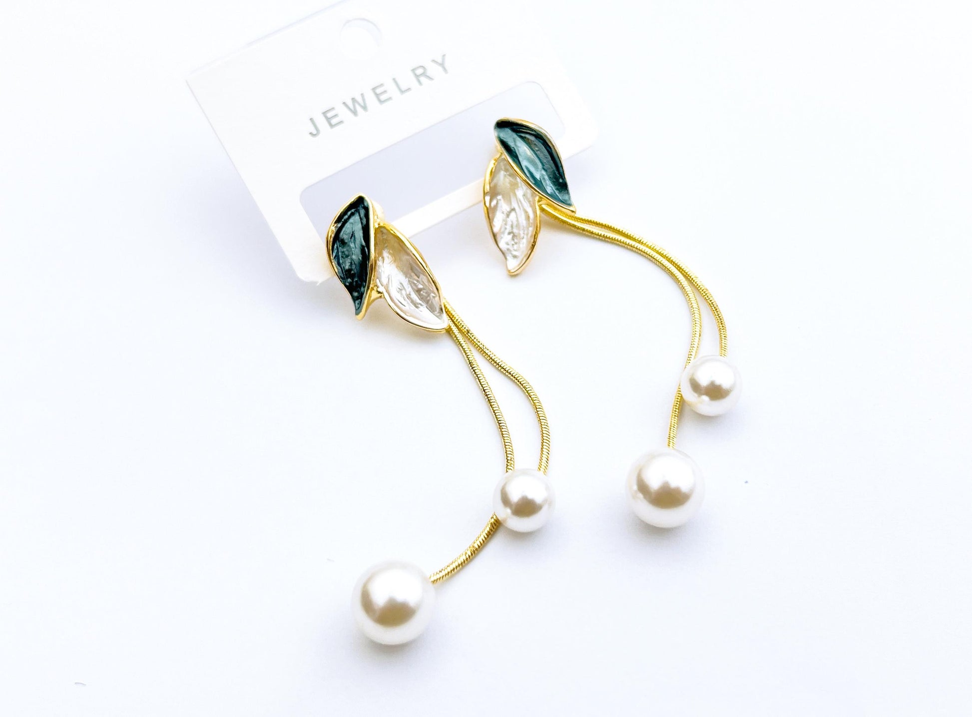 Golden leaf pearl drop earrings with green accents