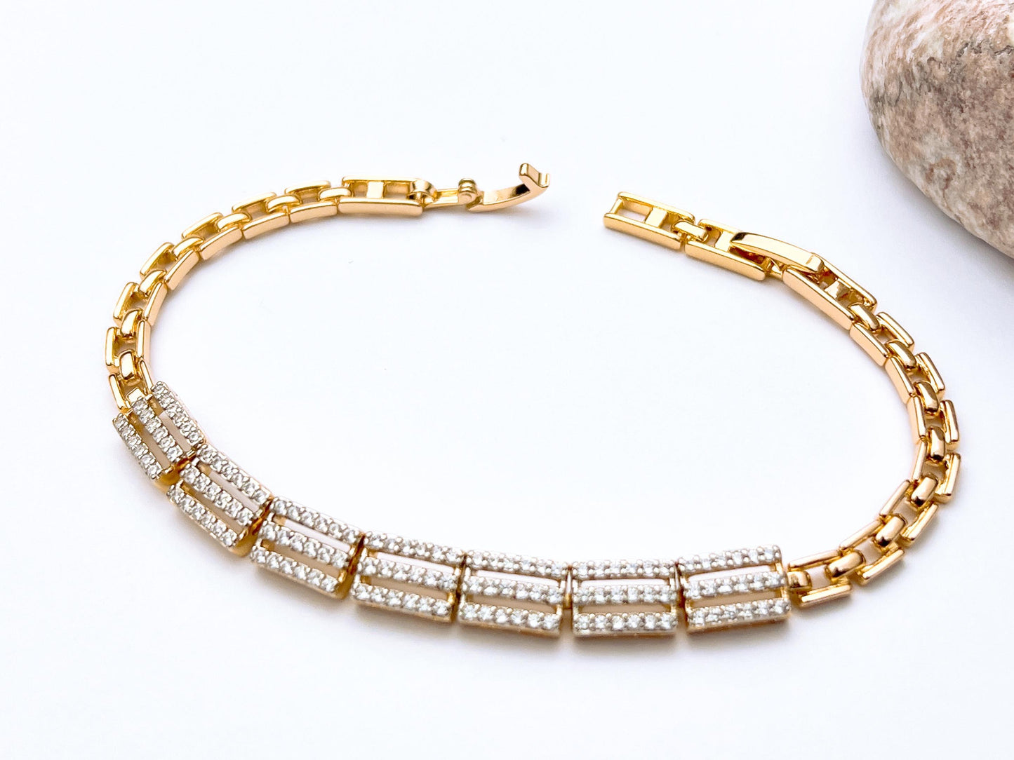Golden crystal link bracelet with stone detailing