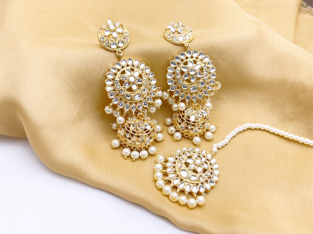 Royal pearl kundan jhumka set in gold tone finish