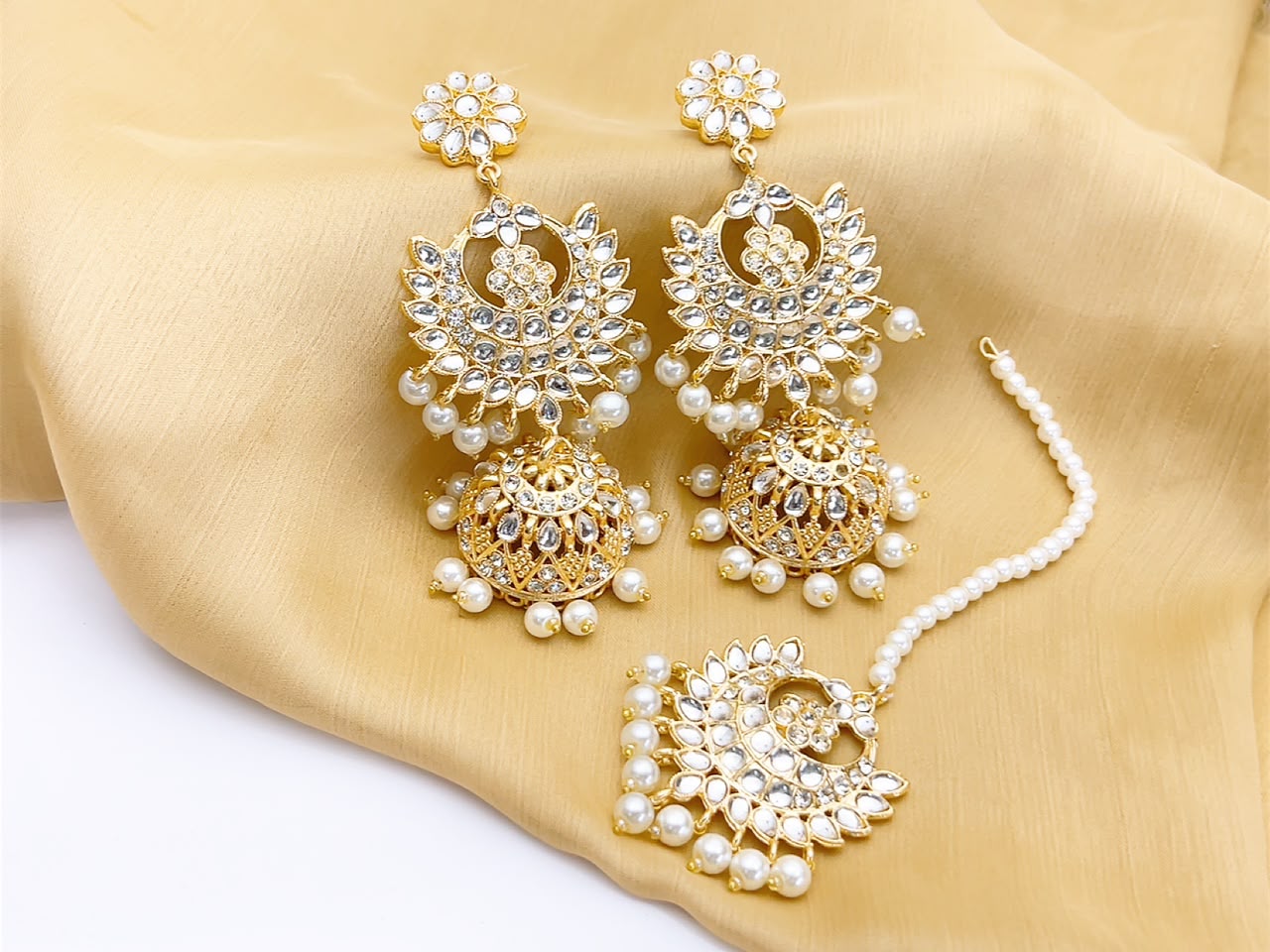 Golden pearl kundan jhumka earrings and tikka set